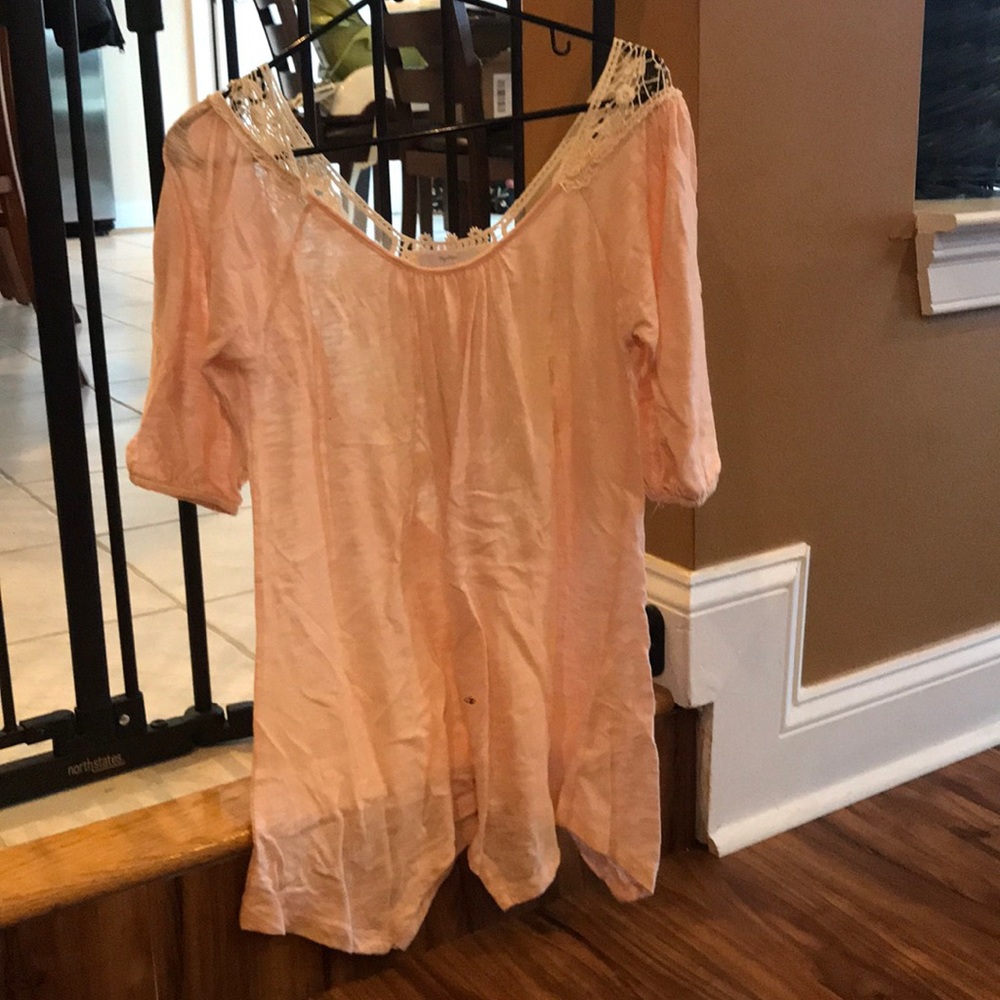 Light pink tunic with lace detail on back